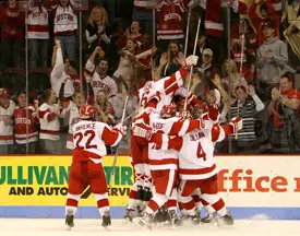 BU celebrates after defeating UVM in Game 3 of their Hockey East quarterfinal.