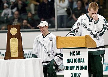 Two faces of joy: Jeff Lerg (l.) is all smiles as captain Chris Lawrence chokes up at the Munn Arena rally.