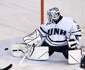 Brian Foster makes one of his 26 saves Saturday night for UNH (photo: Melissa Wade).