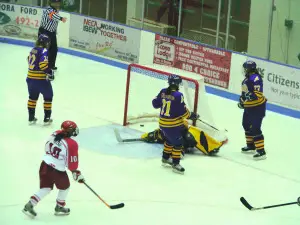 Elmira players stand around after Plattsburgh's first goal.