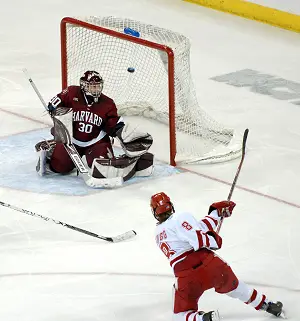 Jinelle Zaugg beats Harvard goalie Brittany Martin for the game winner. / John E. Van Barriger (<a href='http://words-photos.com'></noscript>words-photos.com)” /><p></p>
<div class=