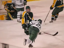 Ray Kaunisto blocks a shot by Dartmouth's Nick Johnson. Photo: Candace Horgan