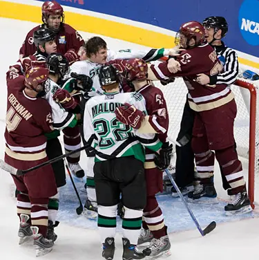 Boston College's Mike Brennan, left, grabs a North Dakota sweater as tempers flare in the second period (photo: Melissa Wade.)