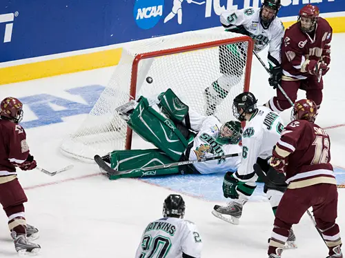 Nathan Gerbe's third goal of the evening gets by a fallen Jean-Philippe Lamoureux (photo: Melissa Wade).