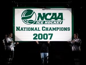 Michigan State hoisted its national-title banner before Friday's game (photos: Ray Bartnikowski).