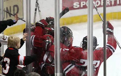 Northeastern celebrates its game winning overtime goal.