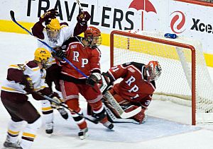 RPI's Mathias Lange sees the puck in the net on the winning goal by Kyle Okposo (upper left) (photo: Melissa Wade).