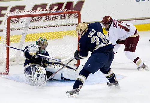 Notre Dame's Ian Cole makes the save on BC's Brian Gibbons for Jordan Pearce.