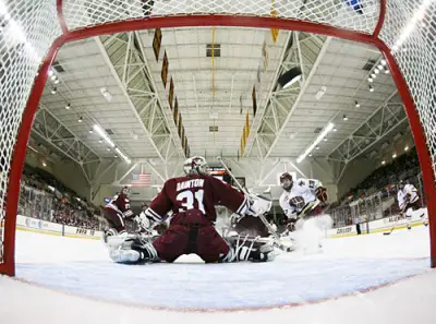 Justin Braun (27) of UMass and Cam Atkinson (13) of BC watch as Benn Ferriero's shot sails into the net past Paul Dainton to make it 1-0 BC at 2:15 of the first period. The power-play goal would stand as the game winner.