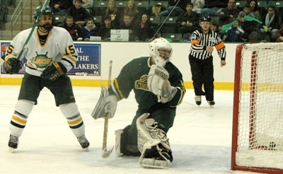 Oswego's Garren Reisweber scoring his hat trick goal against Skidmore in the first game of the Pathfinder Bank Oswego Hockey Classic (photo: Jim Feeney).