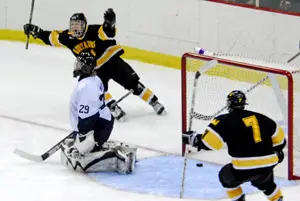 Gustavus scores the winner in OT (photo: Angelo  Lisuzzo).