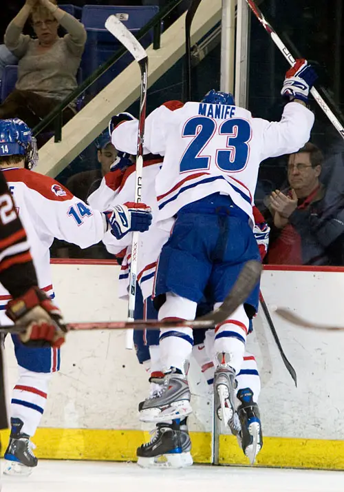 Riverhawks celebrate David Vallorani's goal which cut Northeastern's lead in half midway through the second period (photo: Melissa Wade).