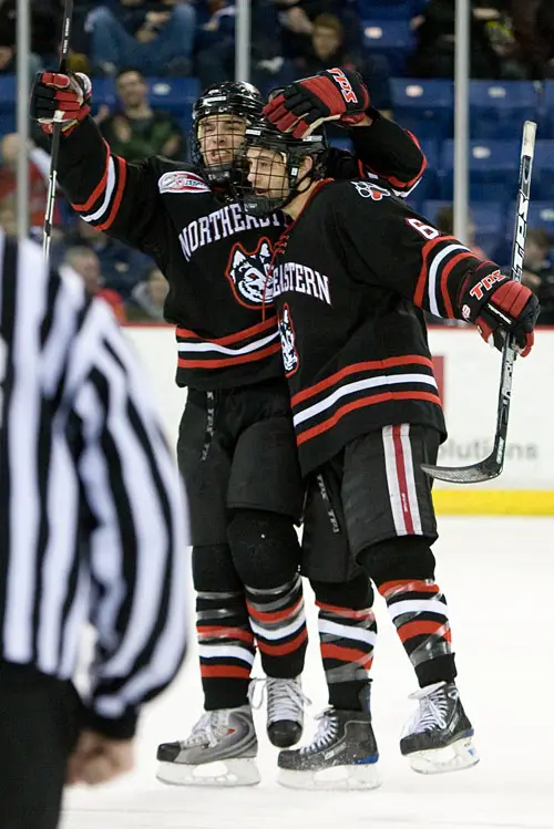 Dennis McCauley and David Strathman celebrate McCauley's goal which put NU up 1-0 at the end of the first period (photo: Melissa Wade).