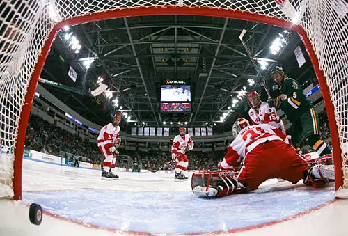 Brayden Irwin watches Justin Milo\'s shot go in 1:18 into the second period to put Vermont up 3-1. Photo by Melissa Wade.