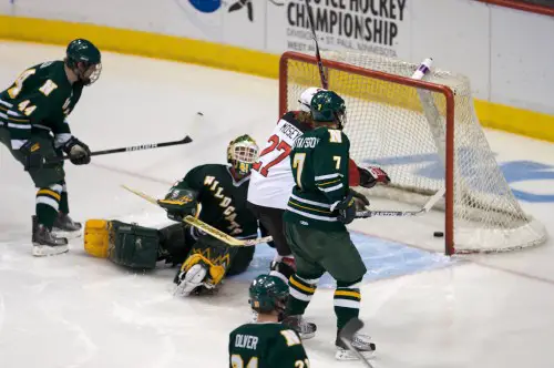 St. Cloud State's Tony Mosey starts the celebration of the Huskies' overtime victory over Northern Michigan (photo: Jim Rosvold).