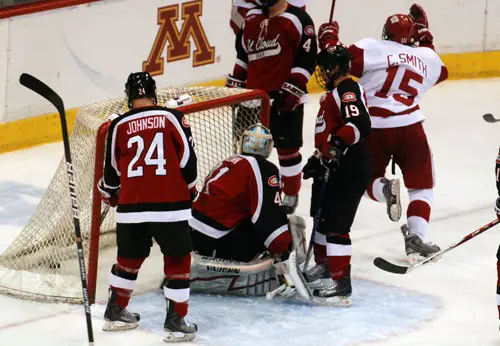 Wisconsin's Craig Smith (15) starts to celebrate a third-period goal by John Mitchell (not shown) in the Badgers 5-3 victory over St. Cloud State (photo: Tim Brule).