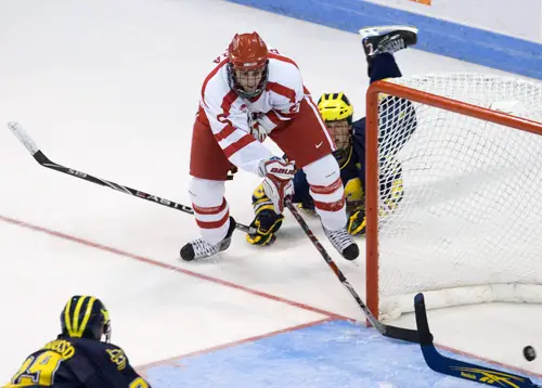 Joe Pereira tucks in the game winner despite Brandon Burlon's efforts (photo: Melissa Wade).