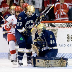 Notre Dame's Calle Ridderwall helps protect goaltender Brad Phillips (photo: Melissa Wade).