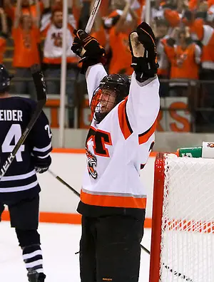 Senior Forward and Captain Andrew Favot celebrates his 100th career point at Ritter Arena, in Rochester, New York. (Dylan Heuer)