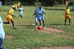 Play in the first game of the Nikumbuke Women's Soccer League. (Tim Brule)