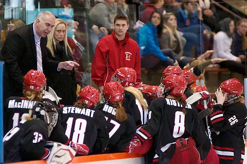 Plattsburgh coach Kevin Houle talks to his players during a stoppage of play (2012 Omar Phillips)