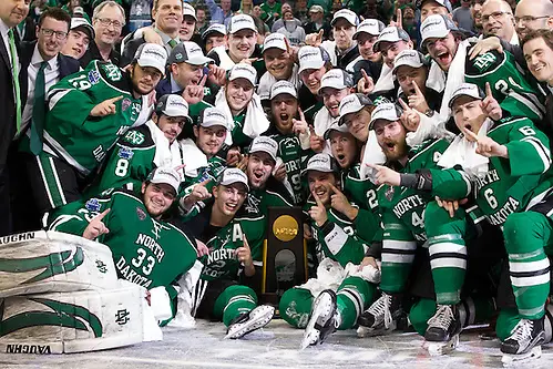 09 Apr 2016: The North Dakota Fighting Hawks celebrate winning the  2016 NCAA Frozen Four at Amalie Arena in Tampa, Florida. (Jim Rosvold)