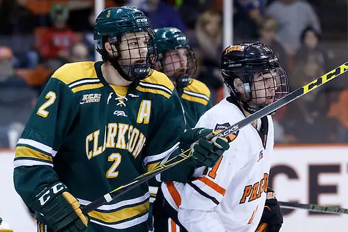 James de Haas (Clarkson - 2) and Alex Riche (Princeton - 11) battle in front of the net. (Shelley M. Szwast)