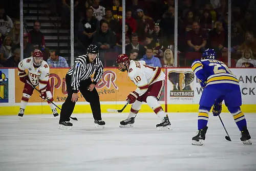 Jaakko Heikkinen of Denver readies for a faceoff. Denver vs. Lake Superior at Magness Arena, 10/20/2017. (Candace Horgan)