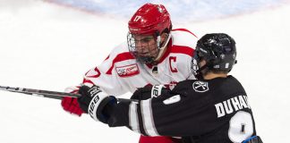 Dante Fabbro (BU - 17), Brandon Duhaime (PC - 9) - The visiting Providence College Friars defeated the Boston University Terriers 5-0 on Friday, October 26, 2018, at Agganis Arena in Boston, Massachusetts. - The visiting Providence College Friars defeated the Boston University Terriers 5-0 on Friday, October 26, 2018, at Agganis Arena in Boston, Massachusetts. (Melissa Wade)