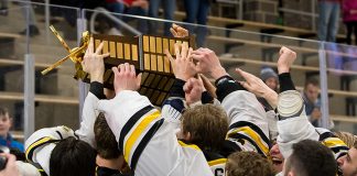 AIC players celebrate winning the 2019 Atlantic Hockey championship (2019 Omar Phillips)