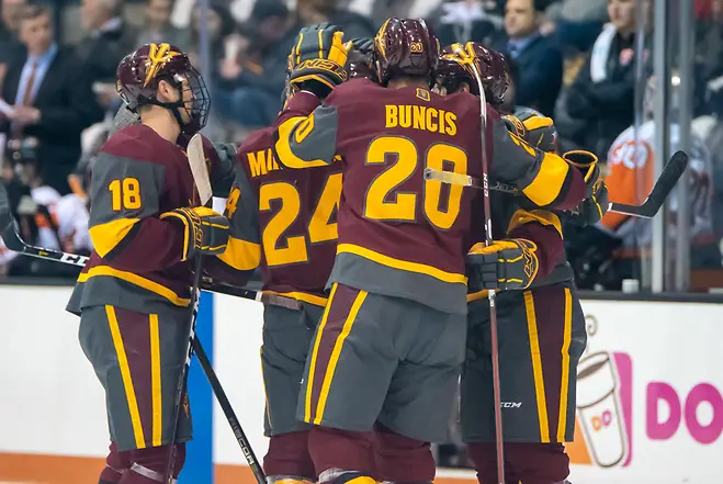 Arizona State players celebrate an early first period goal in a 6-1 win at RIT (2019 Omar Phillips)