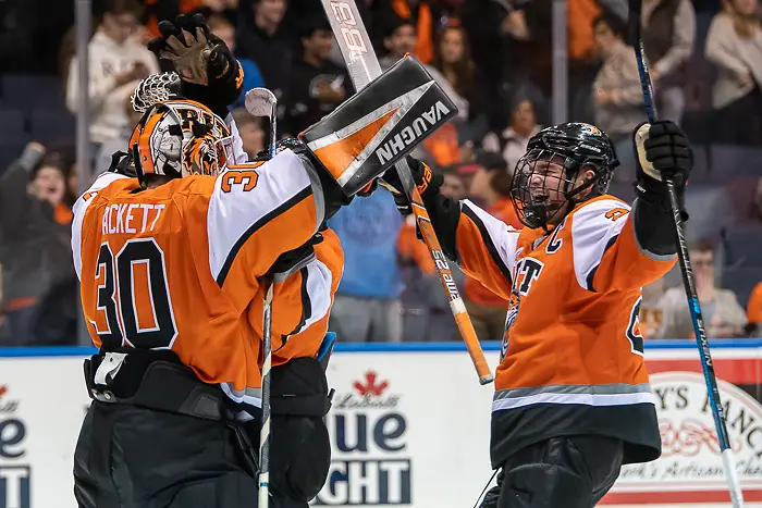 Logan Drackett (30 - RIT) and Darren Brady (23 - RIT) celebrate a 4-0 win over Merrimack (Omar Phillips 2019)